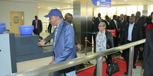 President Uhuru Kenyatta and Margaret Kenyatta going through the checkpoint at the JKIA on October 7, 2014.