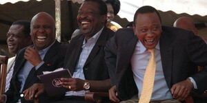 President Uhuru Kenyatta ,former deputy prime minister Musalia Mudavadi and Senator Gideon Moi at Mululu village during a memorial of the 25th Anniversary of the late Moses Mudavadi. 