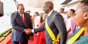 President Uhuru Kenyatta greets his deputy, William Ruto, at Uhuru Gardens during Madaraka Day celebrations on Wednesday, June 1, 2022