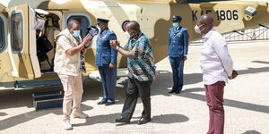 President Uhuru Kenyatta is received by Interior CS Fred Matiang'i as Deputy President William Ruto looks on at the KWS Law Enforcement Academy in Manyani, Taita Taveta County on October 16, 2020