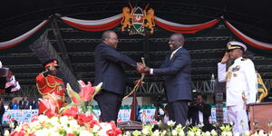 President William Ruto receives the instruments of power from President Uhuru Kenyatta on September 13, 2022.