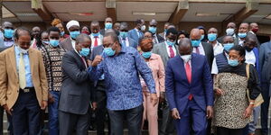 President Uhuru Kenyatta greets National Assembly Majority leader Amos Kimunya at KICC after Jubilee Parliamentary Group meeting on Monday, June 22, 2020