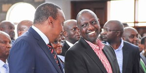 Former President Uhuru Kenyatta (left) with his successor William Ruto (right) at a past church function in Nairobi.