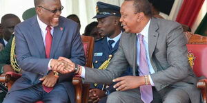 President Uhuru Kenyatta shares a light moment with Tanzanian President John Magufuli during the commissioning of Southern Bypass at Ngong Road-Lenana Interchange in Nairobi. Kenya is fuming at her neighbours over cows, chicken and fish, 2019. 