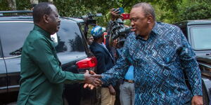 Former Prime Minister Raila Odinga greeting President Uhuru Kenyatta at the SKM Command Center in Karen on July 28, 2023. 