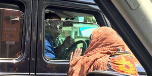 President Uhuru Kenyatta pictured driving himself in Nairobi on February 24, 2019
