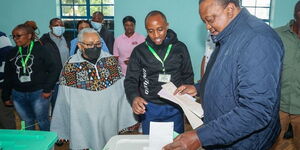 President Uhuru Kenyatta casting his vote at Mutomo primary school polling station on August 9, 2022.
