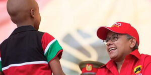 Ryan Mwenda pictured with First Lady Margaret Kenyatta at a Jubilee Party event in September 2016