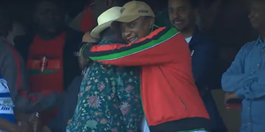 President Uhuru Kenyatta embraces ODM leader Raila Odinga at the Kasarani Stadium, Nairobi on Sunday, March 8