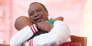 President Uhuru Kenyatta hugs Ryan Mwenda after the young entertainer performed at a Jubilee Party event in September 2016