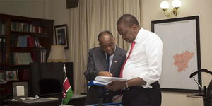 President Uhuru Kenyatta (right) and Head of Public Service Joseph Kinyua