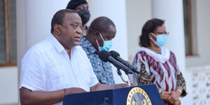 President Uhuru Kenyatta reading the review of containment measures of the virus on August 18, 2021.