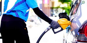 Undated photo of a person fueling a car