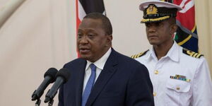 Undated photo of former President Uhuru Kenyatta and his ADC Brigadier Timothy Stelu Lekolool (in white) at a past state event