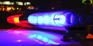 Undated photo of red and blue lights atop a police car