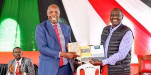 Education CS Ezekiel Machogu and President William Ruto at an event on September 5, 2022.