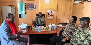 Sirisia MP John Waluke shares a moment with Jubilee Party Secretary General Jeremiah Kioni at the Industrial Area Prison in Nairobi on November 2, 2022. 