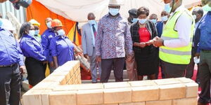 Former Prime Minister (center) at the launch of the Kitui Affordable Housing project on Monday, December 14, 2020.