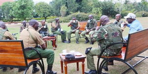 Deputy President William Ruto shares tea with his new security detail at his official residence in Karen.