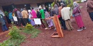 An image of voters lining up to vote in Kandara Constituency by election.