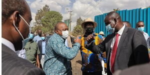 President Uhuru Kenyatta with Raila odinga inspecting NMS project in Kibra