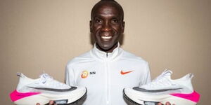 Marathon Record Holder Eliud Kipchoge Holding His Racing Shoes