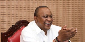 An undated image of president Uhuru Kenyatta breaking into laughter. 