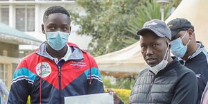 Nakuru Governor Lee Kinyanjui and Godson Chegema who was invited to take part in the trials with the English premier league.