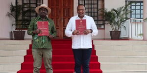President Uhuru Kenyatta and ODM leader Raila Odinga pose for a photo after receiving the BBI report at Kisii State Lodge on Wednesday, October 21