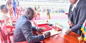 President William Ruto signing official documents of Oath of Office as President of Kenya at Kasarani Stadium on September 13, 2022