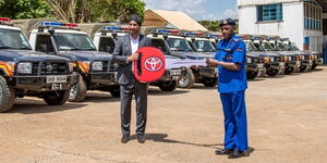 Toyota Managing Director and an officer during a leasing event on November 5,2021