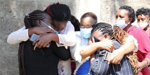 Grieving relatives at the homestead where their five family members were murdered