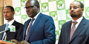 An image of IEBC Commissioner Abdi Guliye (left), Chairman Wafula Chebukati (centre) and Commissioner Boya Molu (right).