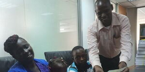 From right; Alfayo Omwenga, his children and wife at constitutional lawyer Ahmednasir's office on Friday, February 21.