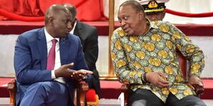 Deputy President William Ruto (left) and President Uhuru Kenyatta enjoy a hearty moment during the BBI launch at the Bomas of Kenya on November 27, 2019. 