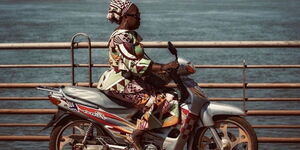 A woman riding a motorcycle