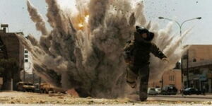 A bomb disposal expert escaping a detonation