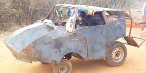 Two mechanics test drive a locally assembled motor vehicle