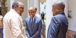 President Uhuru Kenyatta with Health CS Mutahi Kagwe after his swearing-in ceremony at State House on February 28, 2020