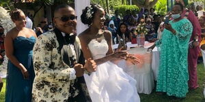 Ex-minister's daughter Juney Karisa and her partner Patrick Mwavula dance during their wedding on Saturday, September 12.