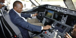 President Uhuru Kenyatta enjoys himself in a cockpit