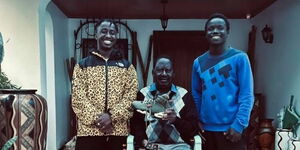 ODM leader Raila receives a pair of sneakers from two men at his home on Thursday, April 22