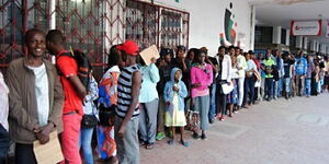 A file image of Kenyans in a queue waiting for services in Mombasa.