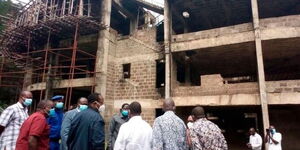 An image of Members of Parliament inspecting the stalled government building in Migori Couty.