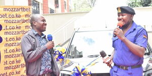 An image of Francis Natembeya receiving his brand new car from Mozzart Bet.