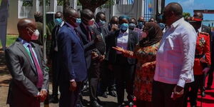 Industrialization CAS David Osiany engaging Tanzanian President Samia Suluhu and President Uhuru Kenyatta at a past event.