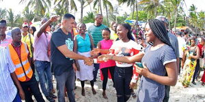 Mombasa Governor Abdulswamad Nassir (in black T-shirt) interacts with members of the public on December 25, 2022. 