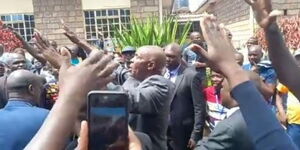 A screenshot of Education Cabinet Secretary Ezekiel Machogu in his attempt to calm down rowdy teachers at St Francis Mang'u High School on January 23, 2023.