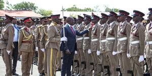 President William Ruto chats with an Administration Police officer while inspecting a pas-out parade on January 11, 2023 at the Embakasi Police College. 
