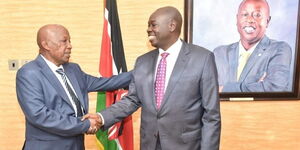 Former Kianyaga High School (left) shakes hands with Deputy President Rigathi Gachagua at his Harambee Annex on January 12, 2023. 